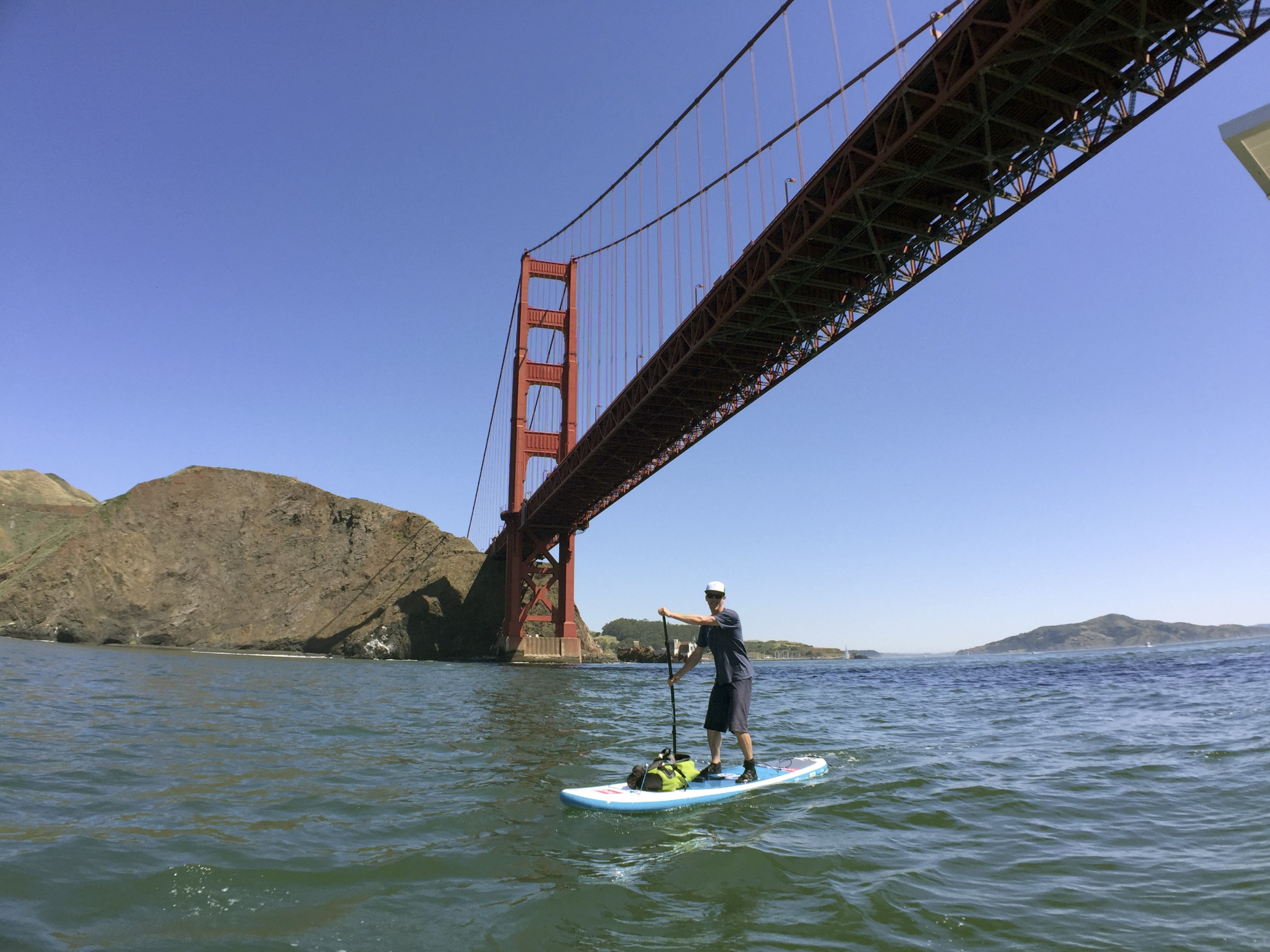 Markus Pukonen stand-up paddleboards under San Fransisco’s Golden Gate Bridge. PHOTO: Routes of Change