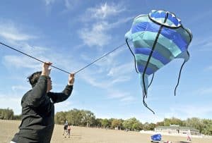 Gary Mark from the Toronto Kite Fliers raises his New Zealand-made pirahna kite over Woodbine Beach on Sept. 20. Mark and other club members got together for an informal flying session under sunny skies – a boon for Mark, who was doing double duty by drying out his kites after the previous afternoon’s downpour. Flying kites is a passion for Mark, who left the following day for a kite festival in Borneo. PHOTO: Jon Muldoon