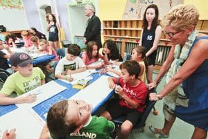 Premier Kathleen Wynne, right, and MPP Arthur Potts, centre, visit summer campers at Community Centre 55 on August 19. PHOTO: Andrew Hudson
