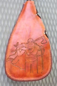 A leather paddle cover etched and laced by Petersen shows his Scandinavian roots. Leather work is another calming activity Petersen enjoys, especially in the paddleboarding off-season. PHOTO: Andrew Hudson