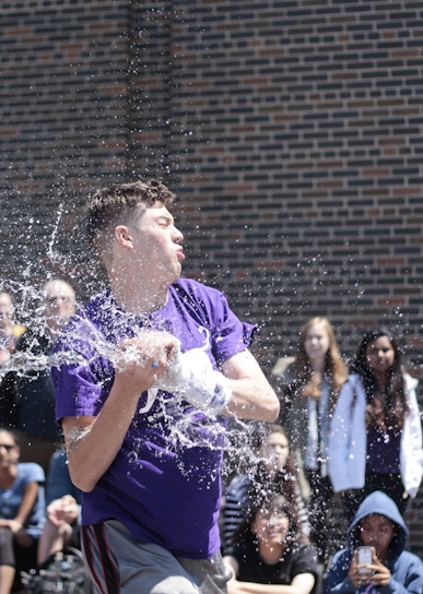 John Ruston, student council president, gets a splash during the annual trebuchet contest at Danforth Collegiate and Technical Institute on June 2. PHOTO: Andrew Hudson