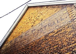 This faded sign for Prest's sporting equipment is more than 100 years old and may be the oldest in the area. PHOTO: Andrew Hudson